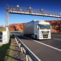 Toll gate and truck
